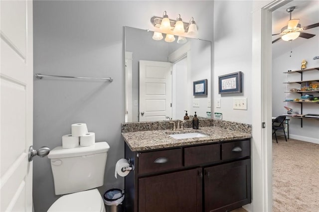2217 Morgan Dr, Auburn, AL 36830 - half bathroom featuring vanity, toilet, and a ceiling fan