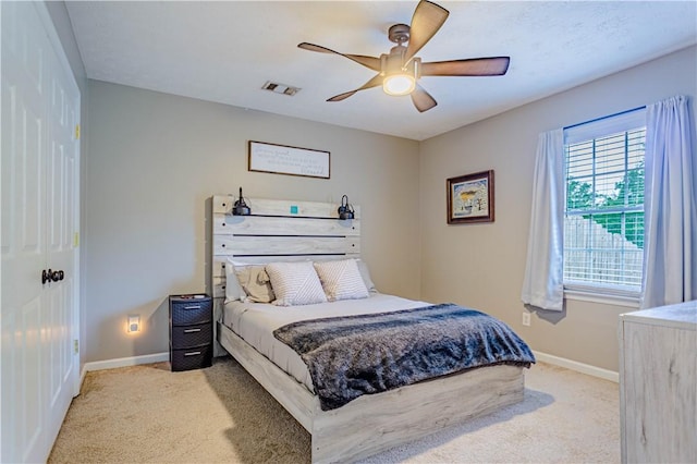 205 Summerbrooke Loop, Phenix City, AL 36870 - bedroom with light colored carpet, baseboards, and ceiling fan