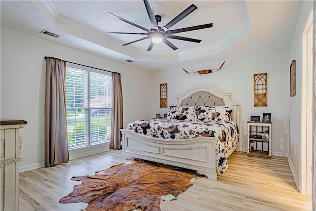 205 Summerbrooke Loop, Phenix City, AL 36870 - bedroom with a tray ceiling, light wood finished floors, crown molding, baseboards, and ceiling fan