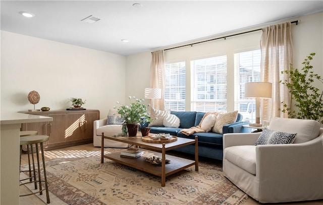 sitting room with visible vents, recessed lighting, and light wood-style floors
