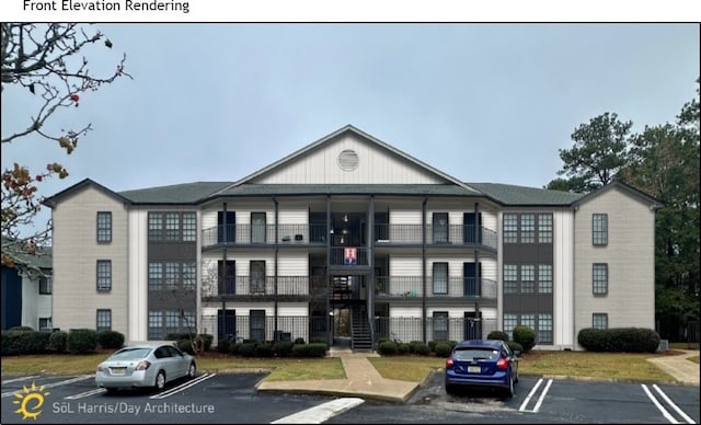 view of property featuring uncovered parking