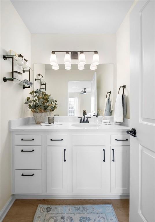 bathroom featuring vanity and wood finished floors