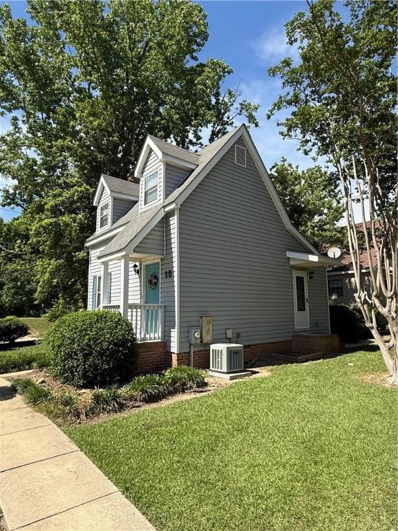 1825 Wire Rd Unit 15, Auburn, AL 36830 - view of home's exterior with central air condition unit and a yard