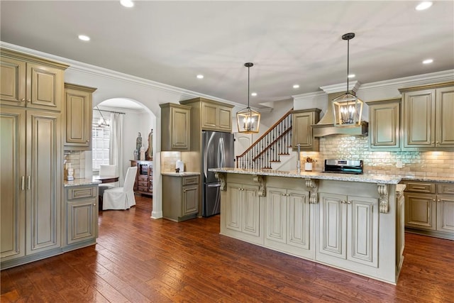 1150 Walden Ln, Auburn, AL 36830 - kitchen with stainless steel appliances, arched walkways, a kitchen breakfast bar, dark wood-style floors, and decorative backsplash