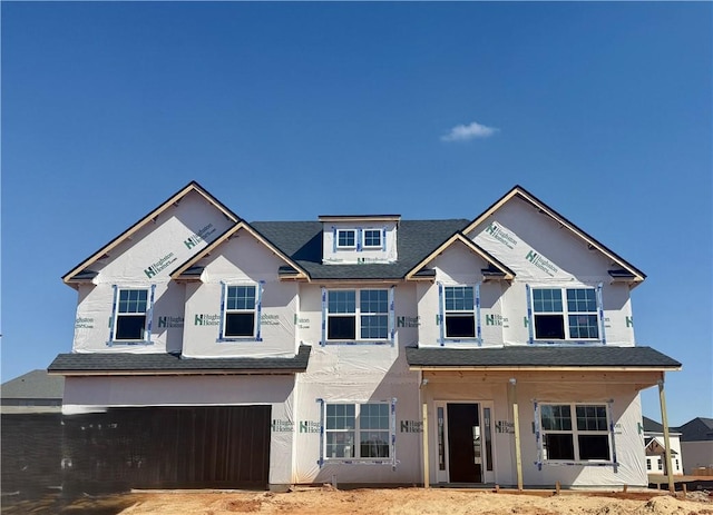 property under construction with an attached garage and stucco siding