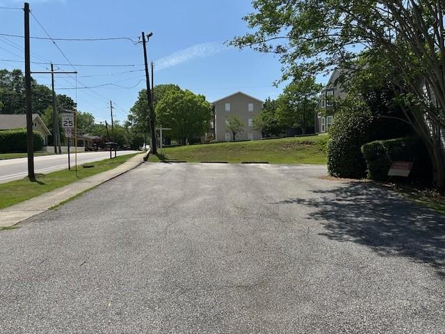 371 E Thach Ave Unit 4, Auburn, AL 36830 - view of asphalt road with sidewalks and traffic signs