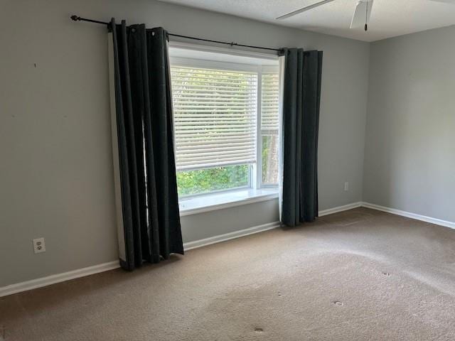 371 E Thach Ave Unit 4, Auburn, AL 36830 - carpeted empty room featuring a ceiling fan and baseboards