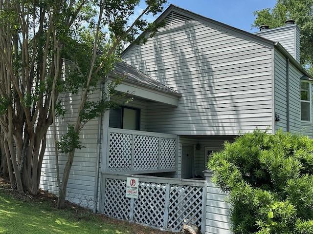 371 E Thach Ave Unit 4, Auburn, AL 36830 - view of property exterior featuring a chimney