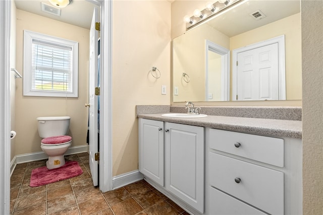 802 W Longleaf Dr Unit 71, Auburn, AL 36832 - bathroom featuring vanity, toilet, and baseboards