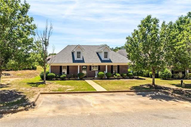 802 W Longleaf Dr Unit 71, Auburn, AL 36832 - cape cod home featuring brick siding and a front lawn