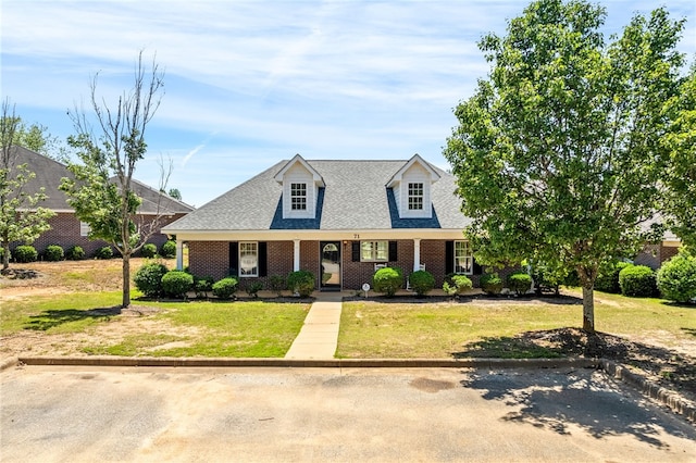 802 W Longleaf Dr Unit 71, Auburn, AL 36832 - new england style home featuring a front lawn, brick siding, roof with shingles, and covered porch