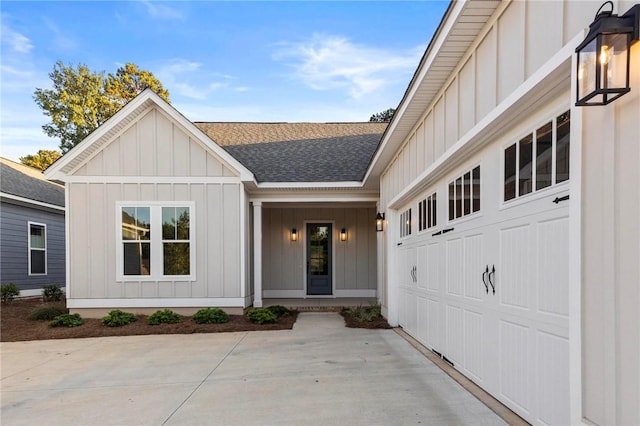property entrance featuring board and batten siding and a shingled roof