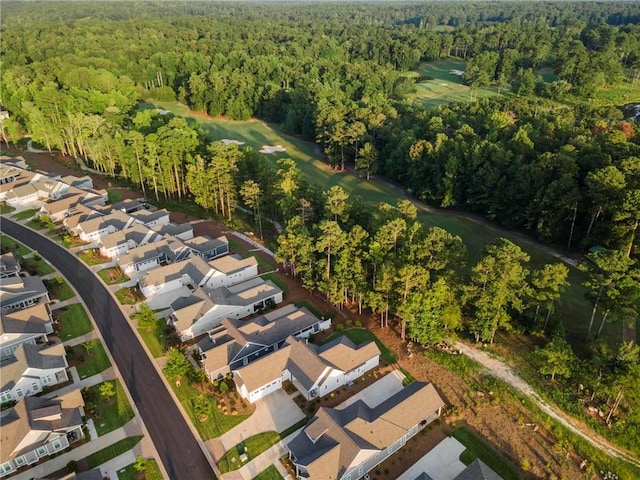 aerial view with a view of trees, a residential view, and golf course view