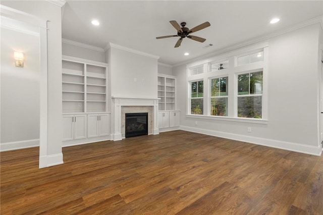 unfurnished living room with ornamental molding, baseboards, ceiling fan, recessed lighting, and dark wood finished floors