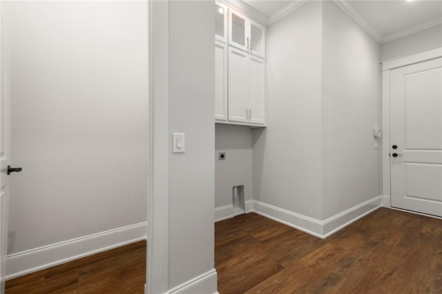 laundry area featuring cabinet space, ornamental molding, baseboards, hookup for an electric dryer, and dark wood-style floors