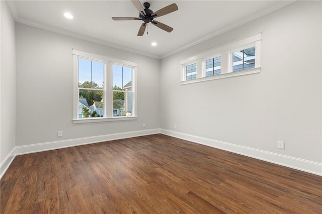 unfurnished room featuring crown molding, dark wood-style flooring, recessed lighting, baseboards, and a ceiling fan