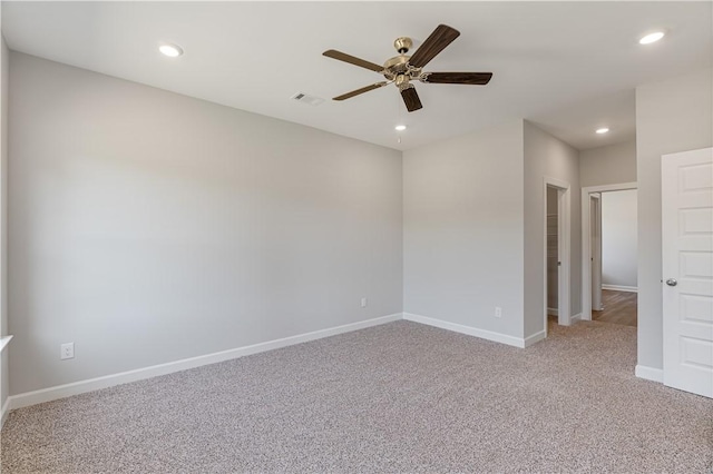 spare room featuring carpet, recessed lighting, visible vents, ceiling fan, and baseboards