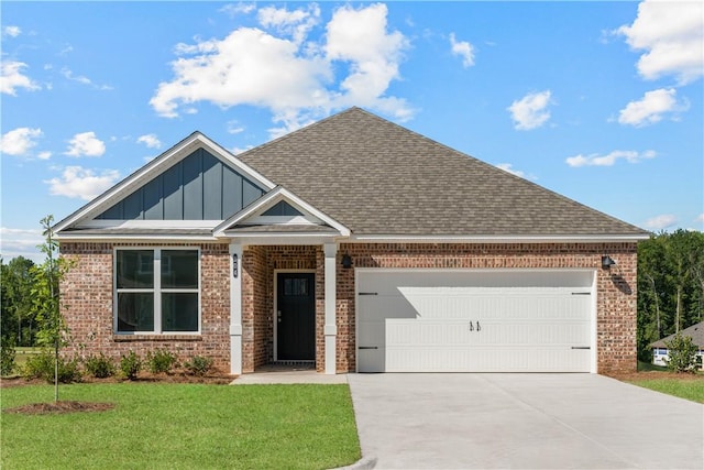 view of front of home featuring a garage, concrete driveway, a front lawn, board and batten siding, and brick siding