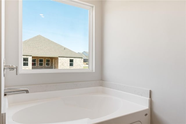 bathroom with a garden tub