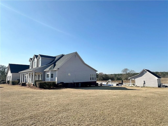 view of home's exterior with a yard