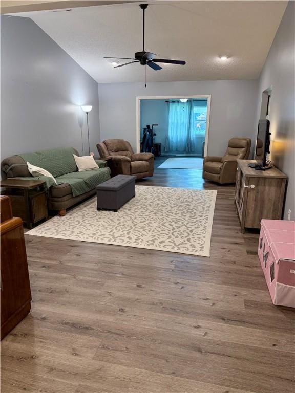 1202 Northgate Dr, Opelika, AL 36801 - living area with vaulted ceiling, ceiling fan, and wood finished floors