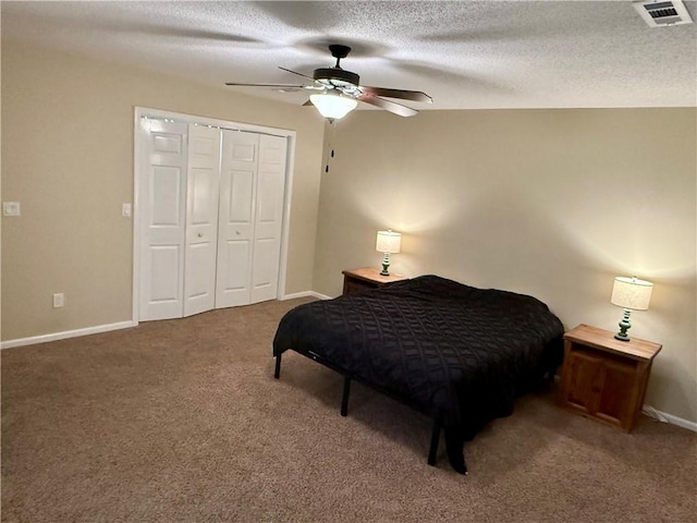 1202 Northgate Dr, Opelika, AL 36801 - bedroom with carpet floors, a textured ceiling, a ceiling fan, and a closet