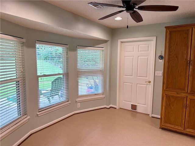 1202 Northgate Dr, Opelika, AL 36801 - empty room with ceiling fan, light colored carpet, and plenty of natural light