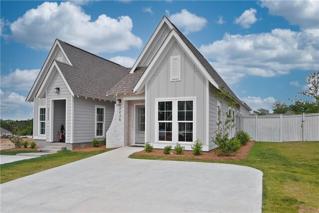 3228 Bradley Ln, Auburn, AL 36830 - view of front facade with board and batten siding and a shingled roof