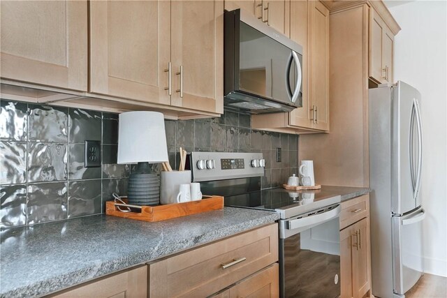 3228 Bradley Ln, Auburn, AL 36830 - kitchen featuring appliances with stainless steel finishes, light brown cabinetry, and tasteful backsplash