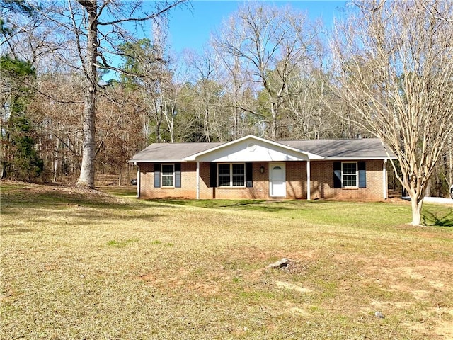 single story home with brick siding and a front lawn