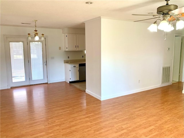 unfurnished living room with a ceiling fan, visible vents, light wood finished floors, and baseboards