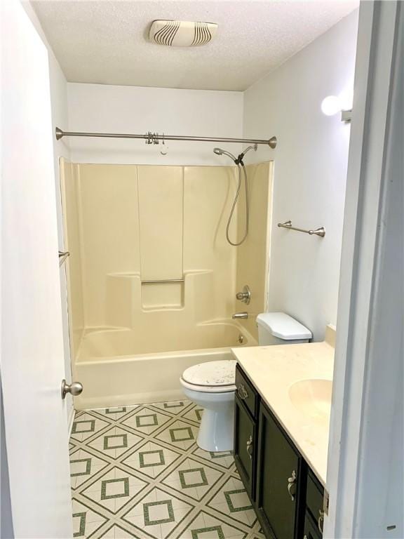 bathroom with visible vents, toilet, a textured ceiling, tub / shower combination, and vanity