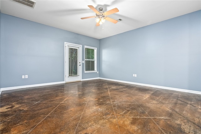 unfurnished room featuring baseboards, visible vents, and ceiling fan