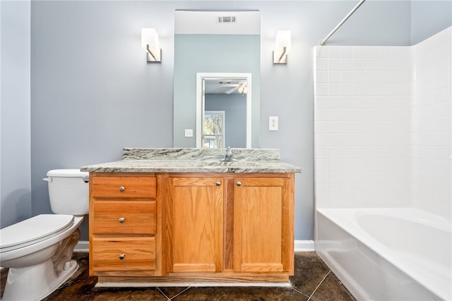 bathroom with bathing tub / shower combination, toilet, visible vents, tile patterned flooring, and vanity