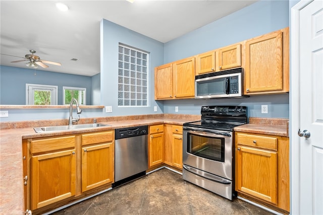 kitchen featuring stainless steel appliances, light countertops, visible vents, a sink, and ceiling fan