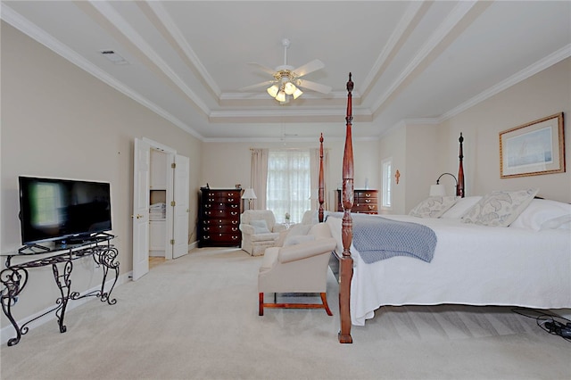 bedroom with ornamental molding, a tray ceiling, light carpet, baseboards, and a ceiling fan