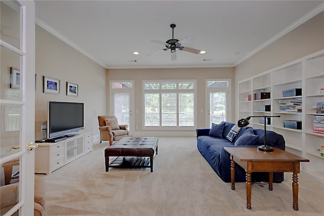 living area with carpet floors, crown molding, a ceiling fan, recessed lighting, and built in shelves