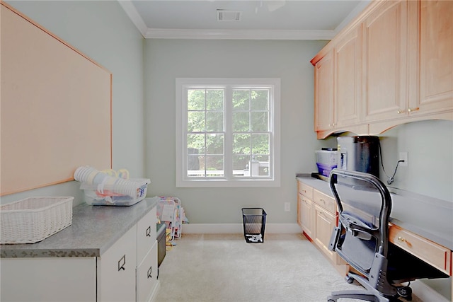 office area with crown molding, light colored carpet, and baseboards