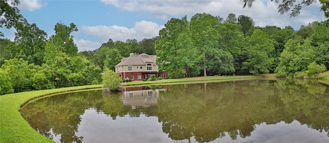 water view featuring a forest