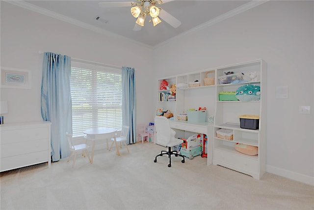 carpeted home office with crown molding and a ceiling fan