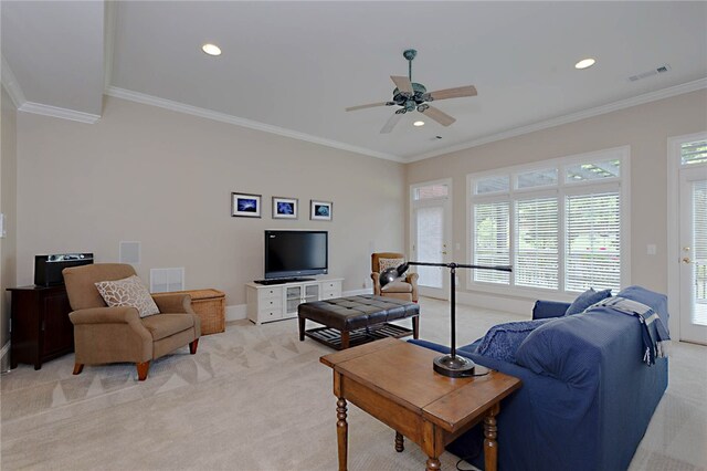 living room with light carpet, ornamental molding, ceiling fan, baseboards, and recessed lighting