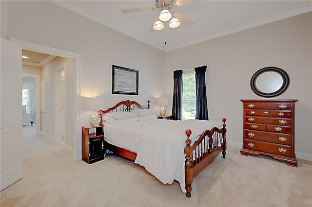 bedroom with multiple windows, carpet flooring, crown molding, and baseboards