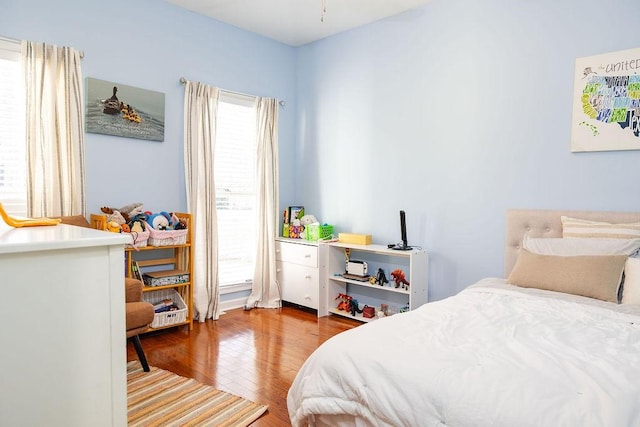 bedroom with hardwood / wood-style flooring