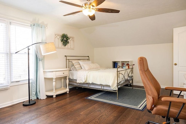 bedroom featuring wood-type flooring, vaulted ceiling, and ceiling fan