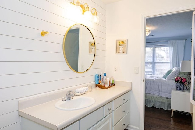 bathroom featuring hardwood / wood-style flooring and vanity