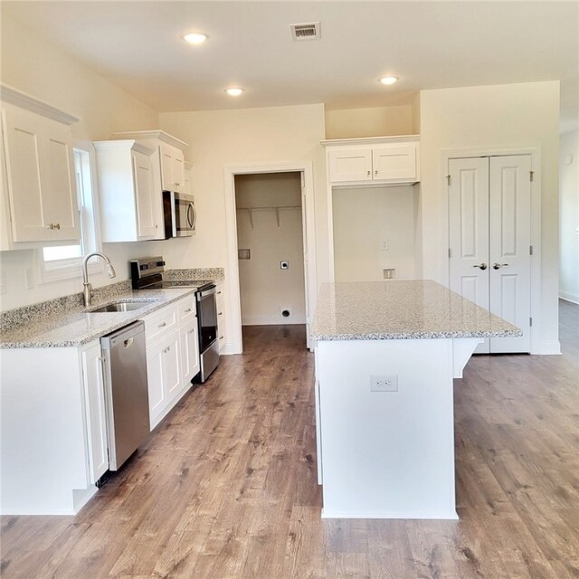 705 Riverside Ests, Lanett, AL 36863 - kitchen with white cabinetry, stainless steel appliances, and a sink
