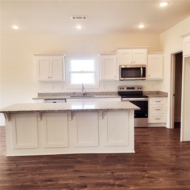705 Riverside Ests, Lanett, AL 36863 - kitchen featuring visible vents, a sink, light stone counters, white cabinetry, and stainless steel appliances