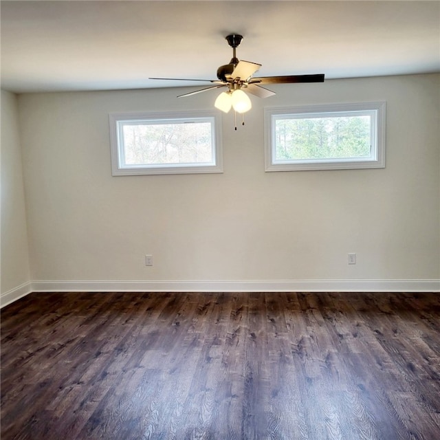 705 Riverside Ests, Lanett, AL 36863 - empty room with a ceiling fan, baseboards, and dark wood-style flooring