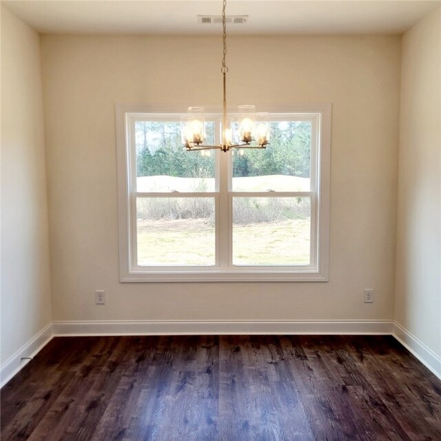705 Riverside Ests, Lanett, AL 36863 - unfurnished dining area featuring visible vents, baseboards, a notable chandelier, and dark wood finished floors