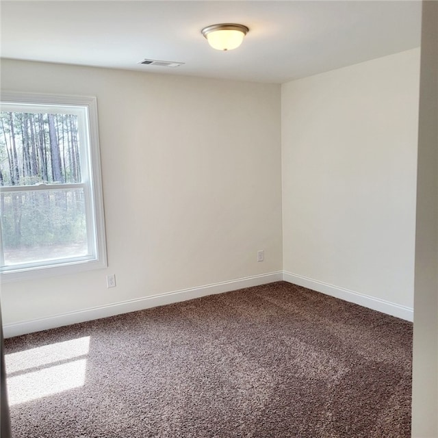 705 Riverside Ests, Lanett, AL 36863 - unfurnished room featuring visible vents, baseboards, and dark carpet
